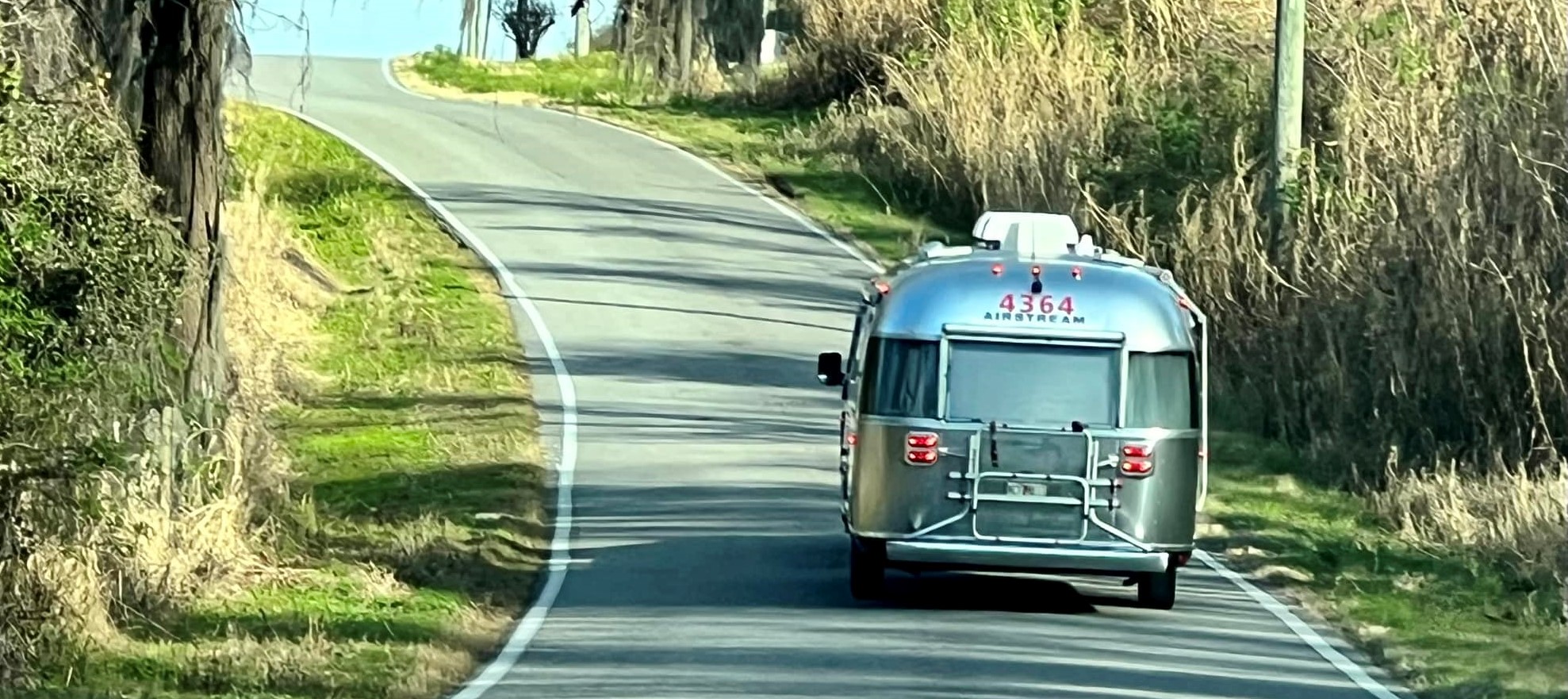 Rear view of Airstream on the road